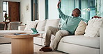 Home, goodbye and couple waving for holiday, leisure or weekend plans in living room. Relax, sofa and black man greeting and woman leaving front door for separate hobby, travel or break in lounge