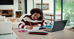 Child, writing and homework in house with laptop, online education and problem solving for math task. Girl, notes and thinking in home with computer, elearning assignment and notebook for numeracy.