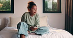 Sad, kid and thinking with phone on bed for cyberbullying, self doubt and overthinking in home. Mental health, child or unhappy with mobile in bedroom for online harassment, rumor shame and isolation