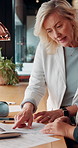 Business, people and discussion in office with paperwork, review financial statements and feedback. Mature woman, conversation and meeting in workplace with documents, finance audit or collaboration.