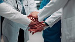 Healthcare, team and hands together in hospital for support, celebration and applause for success. Medical, group and people with stack for mission achievement, nurses and doctors clap for goal