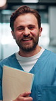 Happy, man and face of nurse in hospital with confidence for career in medical service with documents. Smile, professional and portrait of male healthcare worker with pride for about us in clinic.