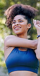 Outdoor, smile or woman with stretching for fitness, warm up routine or active for wellness practice. Below, getting ready or runner with exercise commitment in park, health or workout preparation