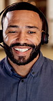 Talking, night and business man in call center for online consulting, financial advisor and contact us. Office, happy and person with headset for communication, finance advice and client support