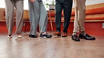 Legs, business people and dance in workplace for celebration, success or financial achievement. Shoes, team and moving to music in office for investment milestone, win or company target at party