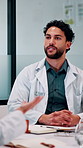 Meeting, doctors and man with discussion in office, medical case review and consulting for treatment. Talking, people and physician with assistance for diagnosis, patient care advice and hospital