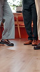 Dancing, team and feet of business people in office with good news, success and celebration. Creative, startup and legs of workers with movement, music and energy for  achievement, promotion and deal