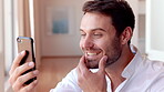 Phone, winner and surprise with man in house for good news, notification and success. Wow, reward points and opportunity with person in living room of home for sales offer, bonus or achievement