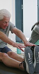 Physiotherapy, stretching or elderly man with yoga for mobility, rehabilitation routine or support. Recovery clinic, specialist or old person with bend for posture exercise, fitness or instructions