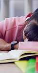 Sleeping, study and teen girl with book, tired and fatigue at desk with homework or revision. Nap, home and academic stress of female pupil with burnout, insomnia and low energy for studying