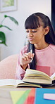 Homework, thinking or teenager in home with books, activity insight or planning essay for assignment. Education, knowledge or girl with writing, quiz answer or problem solving for academic assessment