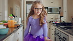 Dancing, girl and child with tutu in kitchen at home, steps rehearsal and coordination development. Weekend fun, childhood and ballerina with music for movement, energy and spin practice in apartment