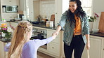 Mother, child and dance in kitchen with music, wooden spoon and bonding together for family connection. Happy, woman and young daughter in home with fun weekend break, support and rhythm for song.