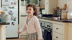 Dancing, home and kid in kitchen with energy, rhythm or creative performance with music. Spoon, groove and girl child moving to radio or playlist with choreography, growth and development in house.
