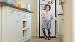 Dancing, home and kid in kitchen with spinning, rhythm or creative performance with music. Ballet, groove and girl child moving to radio or playlist with energy, growth and development in house.
