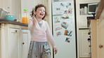 Playing, running and wand with child in kitchen of home for fantasy, imagination or wonder. Development, energy and game with playful girl kid in apartment for excited action, future or growth