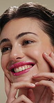 Beauty, thinking and touching with happy woman in studio for cosmetics or dermatology benefits. Skincare, smile and vision with person feeling smooth skin on gray background for makeup inspiration