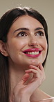 Beauty, thinking and touching with happy woman in studio for cosmetics or dermatology benefits. Makeup, skincare and smile with person feeling smooth skin on gray background for inspiration or vision