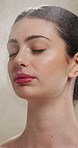 Woman, face and mist for skincare with beauty, moisturiser and product isolated on studio background. Natural cosmetics, female person with spray for hydration, skin glow or dermatology for shine