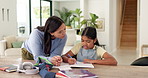 Homework, writing and mom with child with help for education, learning and school activity. Family, home and mother with girl for correct answer, quiz and studying for development, study and support