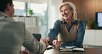 Business, handshake and happy woman with candidate for job interview, HR and meeting with paperwork. Office, mature person and shaking hands with applicant for agreement, recruitment and discussion
