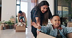 Boxes, parents and children play in new home for bonding, happiness and real estate celebration. Family, moving and homeowner, mom and dad with kids excited and running in house for relocation