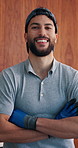 Face, man and plumber with arms crossed at house for plumbing, assessment and maintenance. Portrait, male person and technician with smile for home improvement, property evaluation and repair service