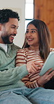 Couple, laugh and online shopping with tablet in lounge, scroll and bonding with partner on weekend. Browsing, website and happy people with tech for internet search, ecommerce and relax in house