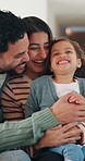 Parents, laugh and tickle child in home with love, trust or humor for bonding together on weekend. Happy people, mother and father play with toddler daughter, family fun or connection in living room.