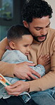 Happy, dad and hug child for card in home, together and fathers day celebration with son or bonding. Family, embrace and gratitude for present, man and connection with boy on special event and love