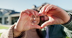 Love, care and happy couple with heart hands for real estate, property investment or commitment. Portrait, man and woman with smile, shape or like emoji for romantic gesture, date or relationship