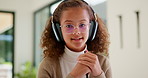 Headphones, video call and face of kid in home with elearning, online class or education. Audio tech, child and portrait of girl student with academic presentation for virtual lesson in apartment.