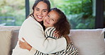 Hug, sofa and face of mom and child in home for loving relationship, bonding and affection. Family, happy and portrait of mother and girl embrace for connection, trust and security for motherhood