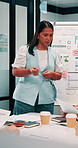 Whiteboard, documents and businesswoman in office for meeting with team for investment strategy. Discussion, paperwork and female financial manager with people for planning company revenue growth.
