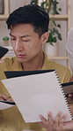 Frustrated man, documents and overwhelmed with team, stress or paperwork for multitasking. Male person, anxiety and demanding employees with time management, tasks or deadline for creative project