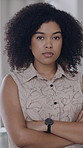 Serious, face and woman in office with arms crossed, creative job and experience for marketing agency. Confident, African person and employee in business with advertising career, pride and about us.