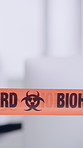 Biohazard, tape and warning or caution for infection or virus, barrier or medical emergency staff. Bacteria, crisis and contamination with people cleaning, investigation and risk or danger by space