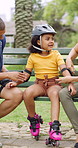 Roller skating, parents or girl in park with safety gear, childcare advice and support in summer hobby. Smile, help and family with elbow pads, parent guidance and connection for child development.