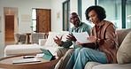 Angry, couple and argue with document in home for finance error, payment fail and debt pressure. African people, disagreement or tablet with mortgage notice, financial bankruptcy and eviction warning