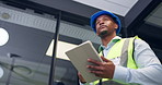 Construction, thinking and black man on tablet in office for inspection, renovation idea and report. Architecture, below and person on tech for compliance, building assessment and engineering plan