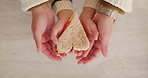 Hands, parent and child with heart for sandwich, bonding and love with nutrition for wellness in home. People, mother and kid with bread, food and above with symbol, support or sign at family house