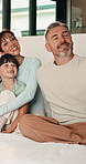 Bedroom, love and selfie with parents, kids and smile together for social media update in morning. Mother, father and picture with happy children at home, hug and photography for family connection