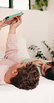 Relax, siblings and children on sofa with tablet for online streaming, internet or cartoons together. Family, home and boy with girl on digital tech for entertainment, videos and bonding on weekend