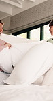 Smile, children and playing with pillow in bedroom for fun, playful interaction and friendly battle. Happy, siblings or combat with cushion, morning activity and funny games for weekend break in home