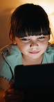 Streaming, night and girl in house with tablet, funny movie and cartoon watching on digital app. Evening, tech or child in bedroom with laugh, series subscription or search on entertainment platform