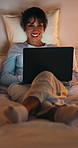 Laptop, smile and thinking with woman in bed for planning, research or remote work at night. Computer, ideas and typing with mature person in dark bedroom of home for freelance career or development