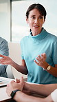 Woman, meeting and coaching with team in office for project proposal, ideas or agenda. Female person, employee or mentor talking with colleagues for company strategy or training staff in workplace