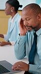 Laptop, research and businessman with headache in office, pain and tax preparation with info on web. Coworking, team and black person with audit pressure, thinking and mature bookkeeper with migraine