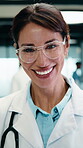 Doctor, face and happy woman with medical career, about us or confident in hospital hallway. Smile, portrait and mature physician in glasses with laugh for healthcare service, trust or job excellence