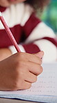 Homework, hands and child with book in home, math equations and learning for problem solving skills. Pencil, exam practice and girl with calculation for multiplication question, study and assignment